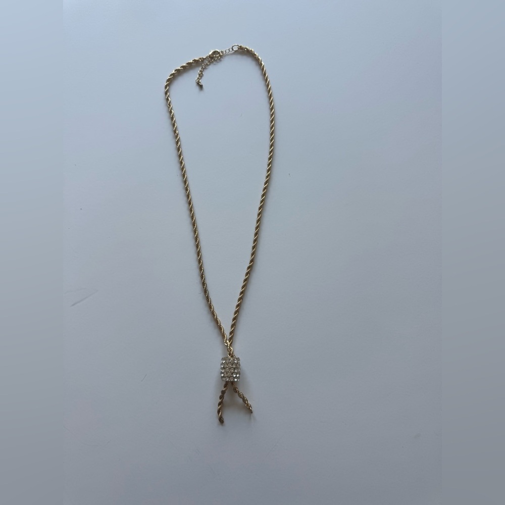 Gold Costume rope necklace with sparkle barrel accent.